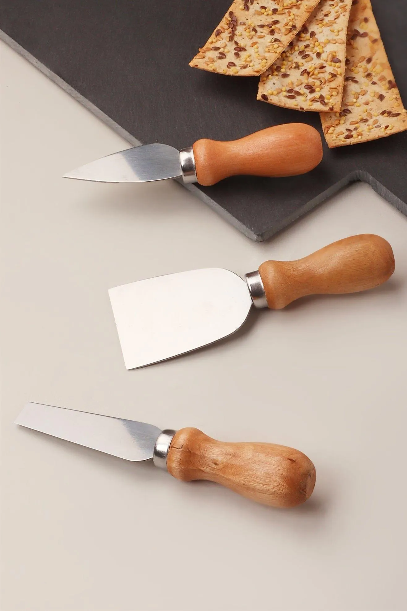 A set of 3 Cheese Knives and Board